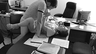 The boss fucks his little secretary on the office table and films it on hidden camera
