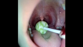Asian Adolescent Rubbing Uvula with Lollipop (original Footage)